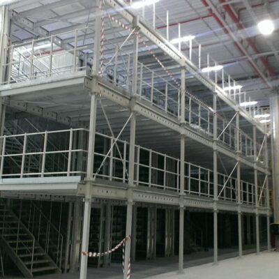 A corner of a warehouse mezzanine with a protective railing