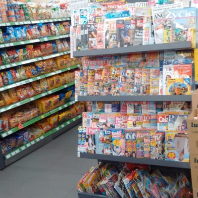 Gondola shelving with a top shelf for newspapers