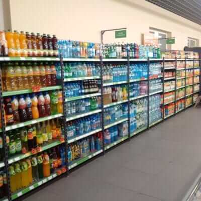 A line of wall mounted shelves for drinks